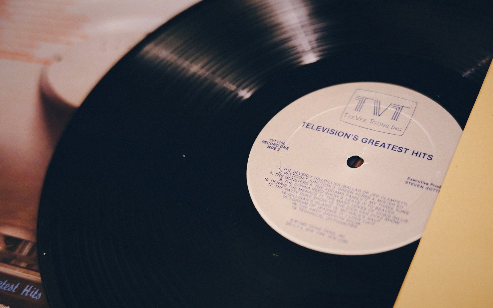 Vinyl record resting on its sleeve, showing the Television's Greatest Hits label
